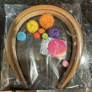 Brand new Tan Faux Leather Headband with a surprise free gift.